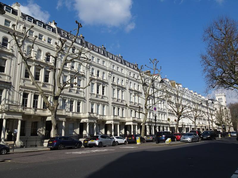 Row of London terraced houses in sunshine